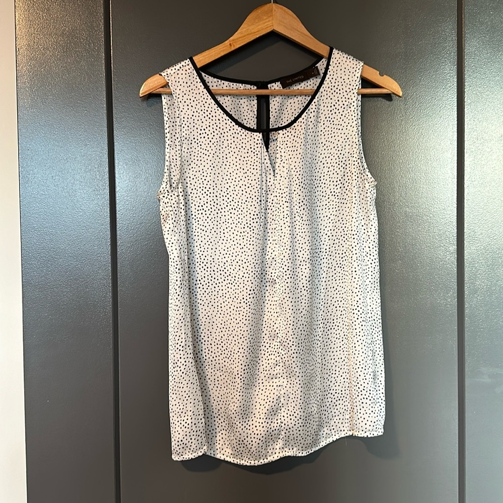 The limited polka dot satin like blouse
